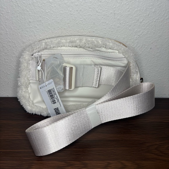 lululemon fleece bag ivory light 'everywhere fleece' belt *1L *new with tags Belle Boutique Consignment This item has a purchase limitup to 5 of the same colour or 10 of different colours. Lululemon Everywhere Belt Bag 1L